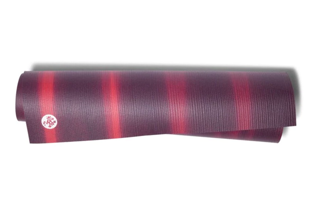 Vibrant Manduka PRO Yoga Mat in Indulge Colorfields design, made from high-density PVC material for superior support and cushioning. Slip-resistant surface ensures stability during yoga practice.